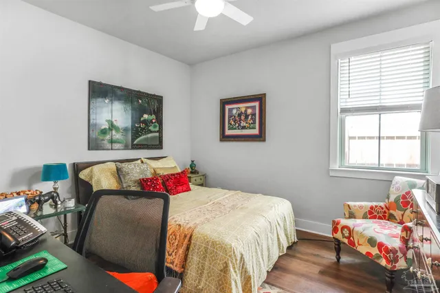 a bedroom with bed and a window