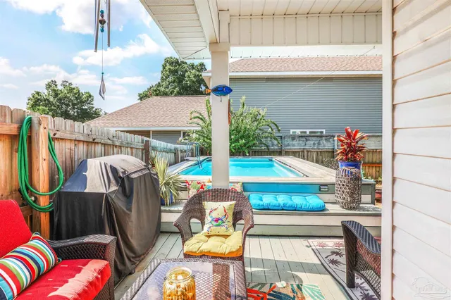 a view of swimming pool with outdoor seating