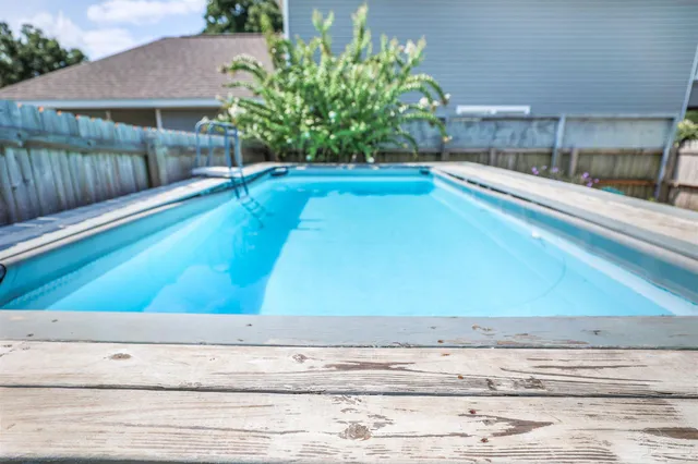 a view of a living room with a ceiling fan