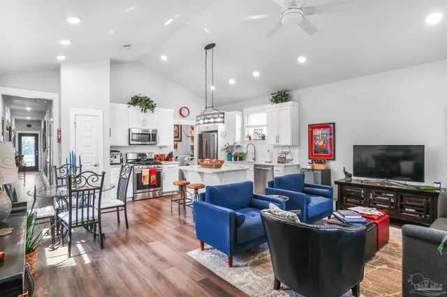 a living room with furniture and a flat screen tv