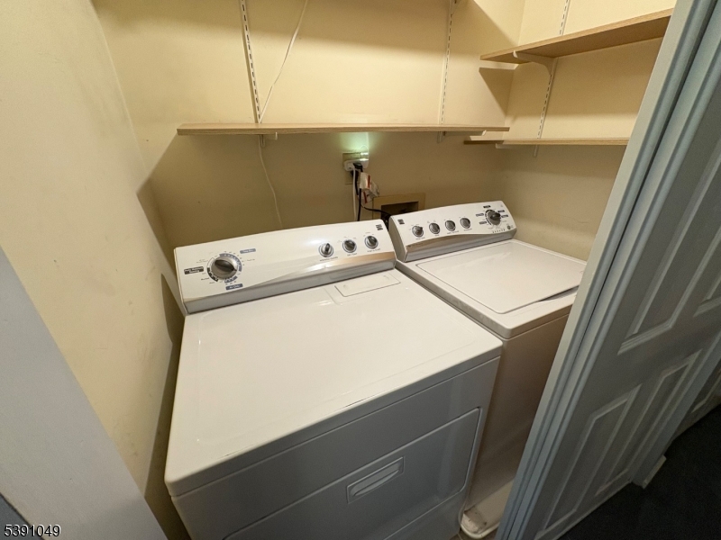 77 Howard Street Newark, NJ 07103 - Photo 14 of 14 a utility room with dryer and washer