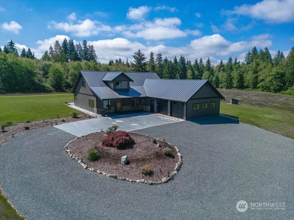 1680 Butler Creek Road Sedro-Woolley, WA 98284 - Photo 1 of 40 a view of a house with a yard