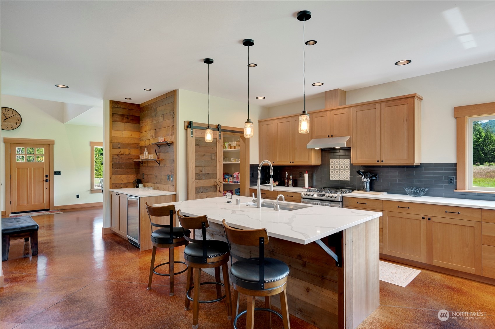 1680 Butler Creek Road Sedro-Woolley, WA 98284 - Photo 12 of 40 a large kitchen with a table and chairs