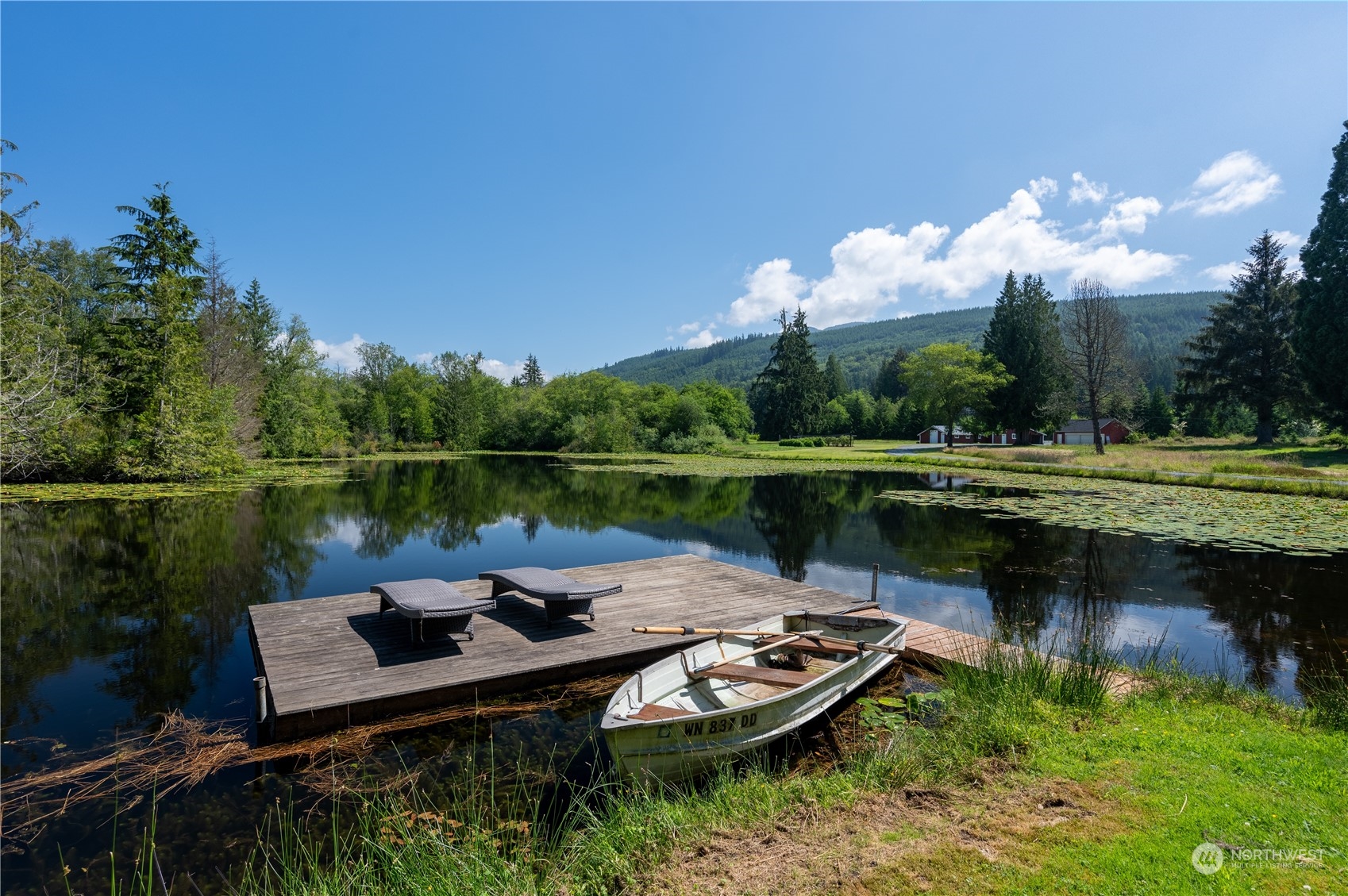 1680 Butler Creek Road Sedro-Woolley, WA 98284 - Photo 2 of 40 a view of a lake with a deck yard and outdoor seating