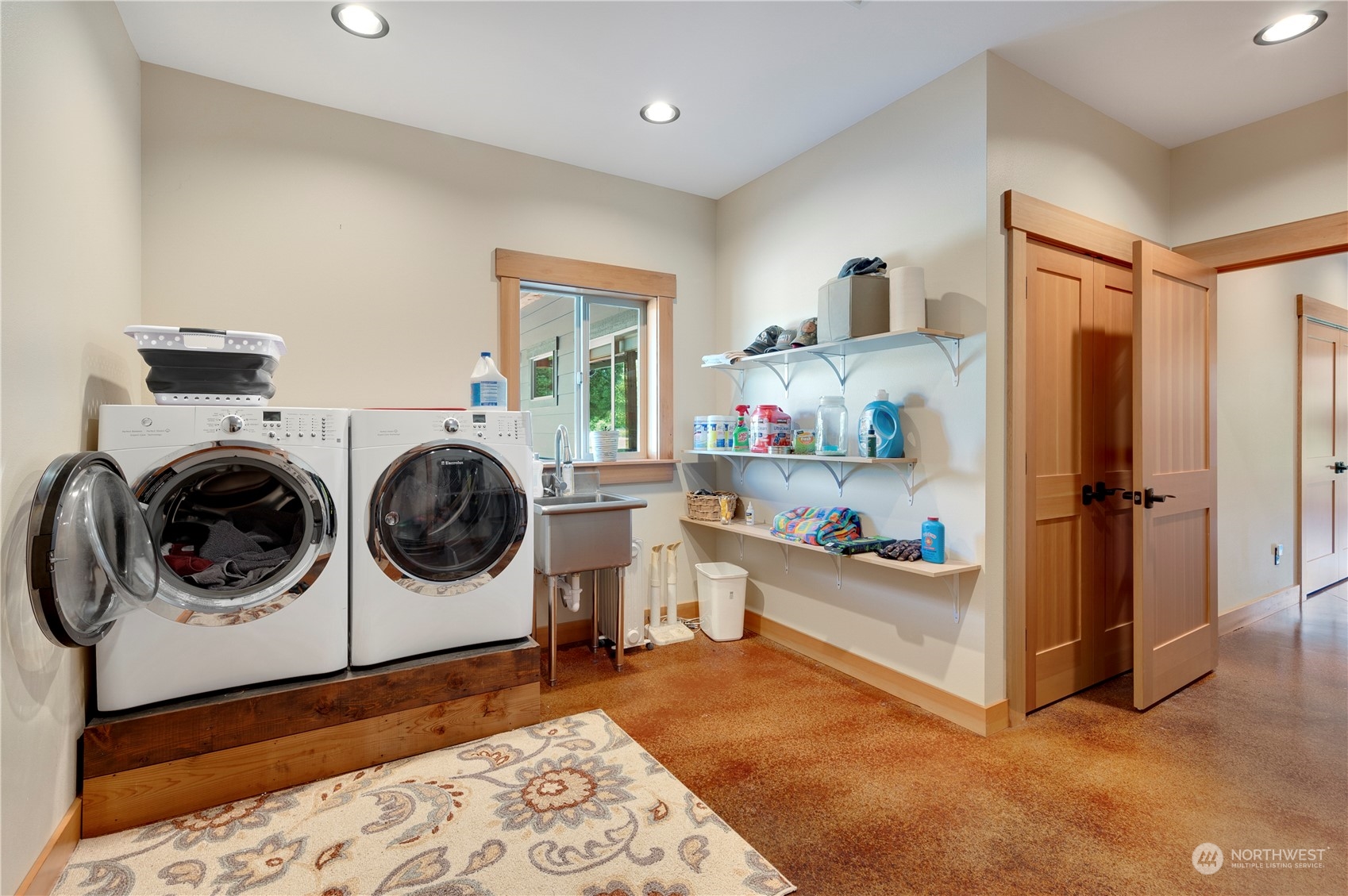 1680 Butler Creek Road Sedro-Woolley, WA 98284 - Photo 27 of 40 a view of a bedroom with washer and dryer