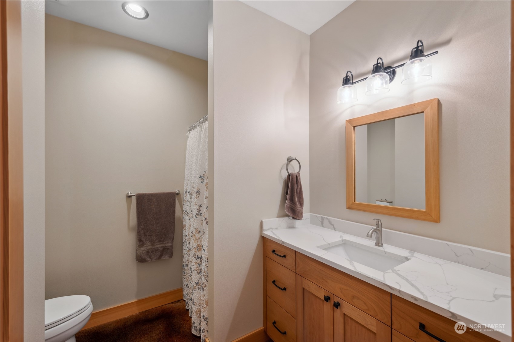 1680 Butler Creek Road Sedro-Woolley, WA 98284 - Photo 31 of 40 a bathroom with a toilet sink and mirror