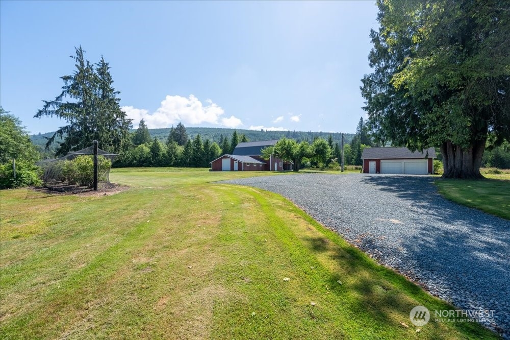 1680 Butler Creek Road Sedro-Woolley, WA 98284 - Photo 36 of 40 a view of a swimming pool with a yard