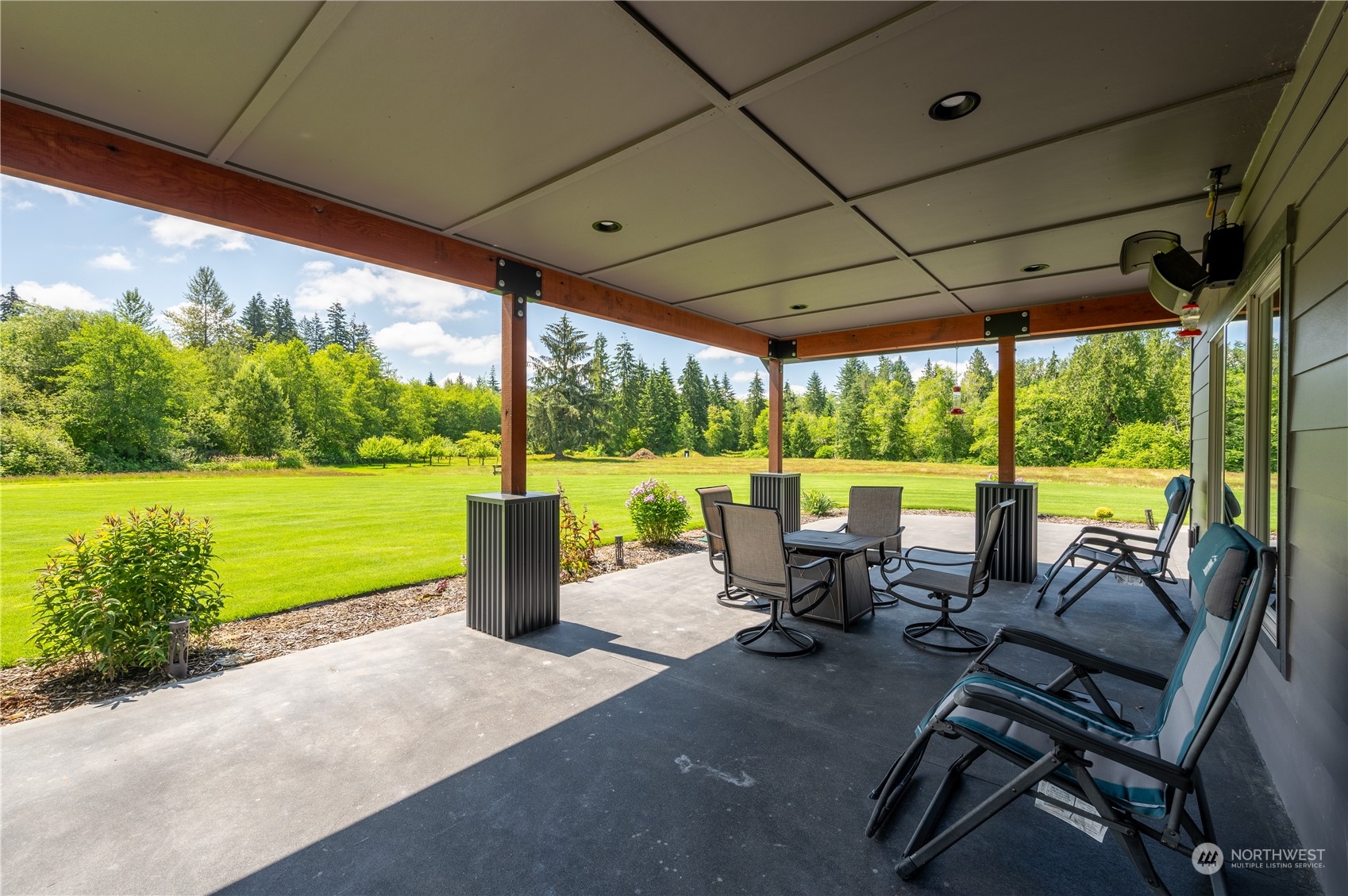 1680 Butler Creek Road Sedro-Woolley, WA 98284 - Photo 4 of 40 a view of chairs and table in patio with a yard