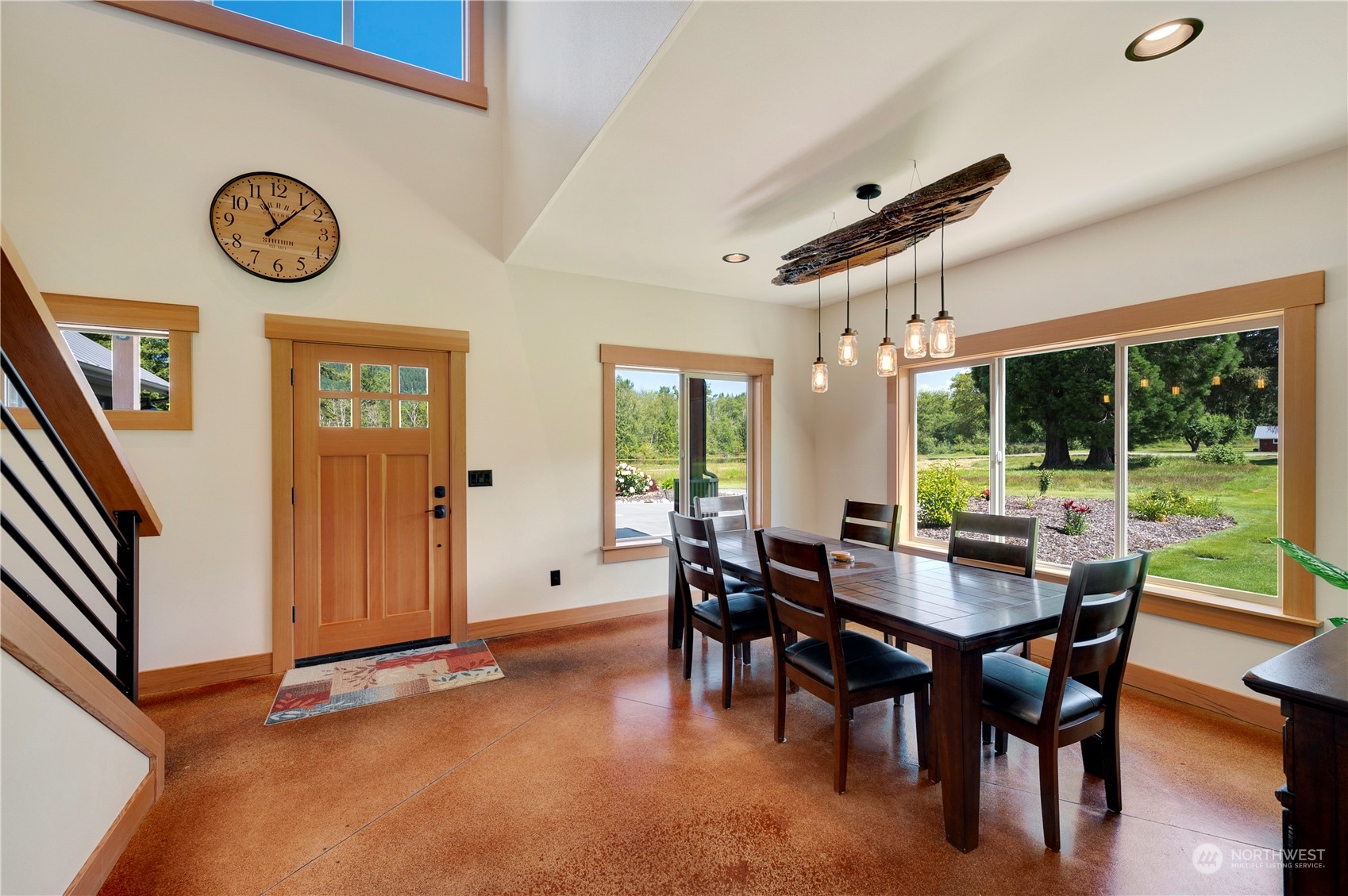 1680 Butler Creek Road Sedro-Woolley, WA 98284 - Photo 6 of 40 a view of a dining room with furniture window and wooden floor