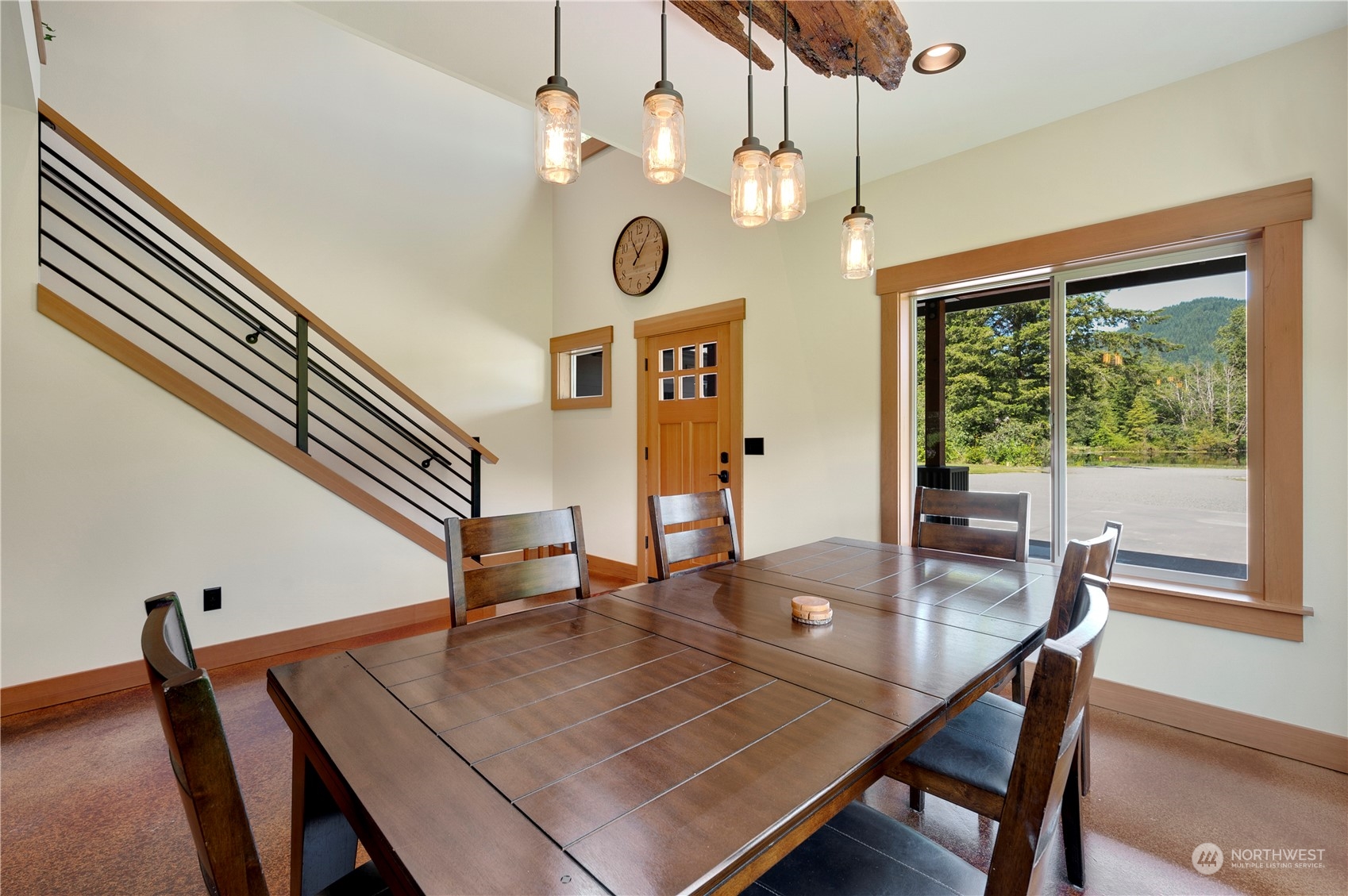 1680 Butler Creek Road Sedro-Woolley, WA 98284 - Photo 7 of 40 a view of a dining room with furniture window and wooden floor