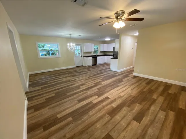a view of an empty room with a window