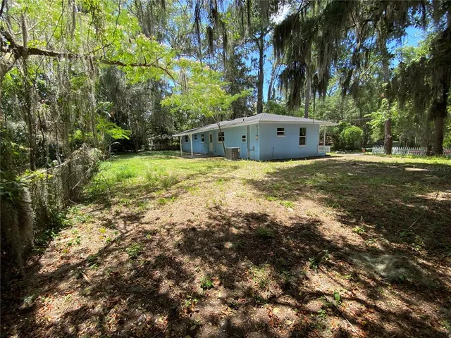 a backyard of a house with lots of green space