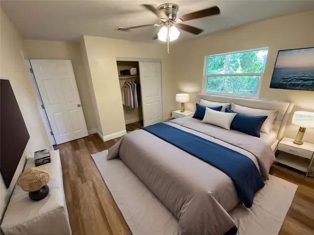 a bedroom with a bed and a window