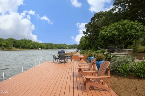 a view of a lake with outdoor seating