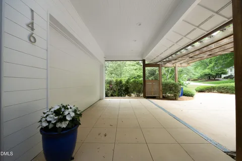 a backyard of a house with lots of green space and trees all around