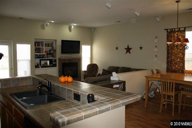 10285 Grizzly Hill Court Reno, NV 89521 - Photo 3 of 13 a kitchen with a stove a sink and a refrigerator
