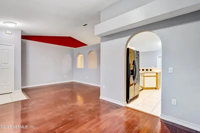 a view of a living room with a fireplace