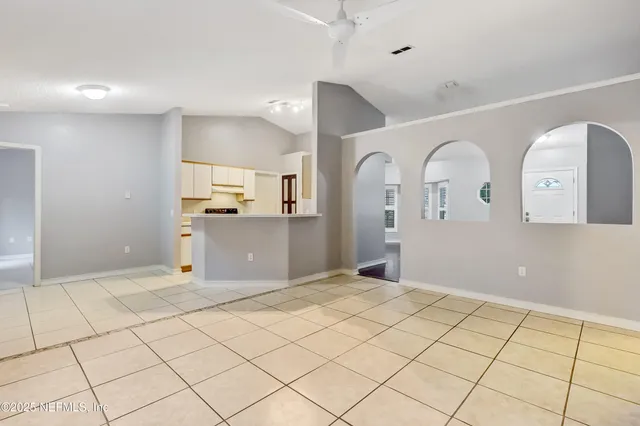 a view of an empty room and window