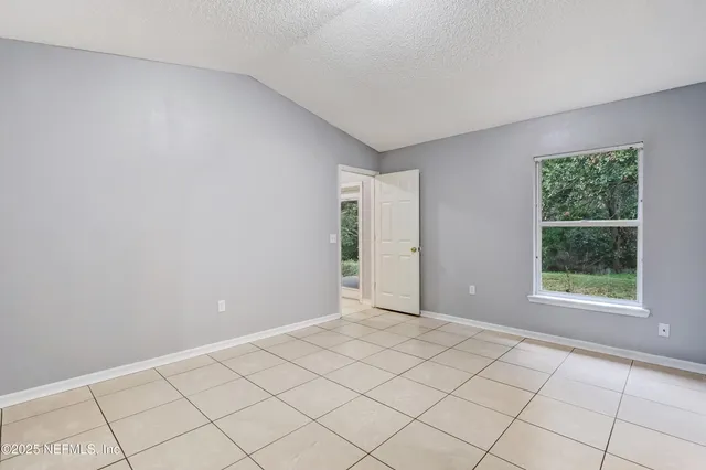 a bathroom with a shower and toilet