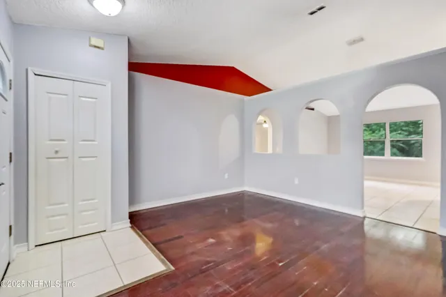 a view of an empty room and window