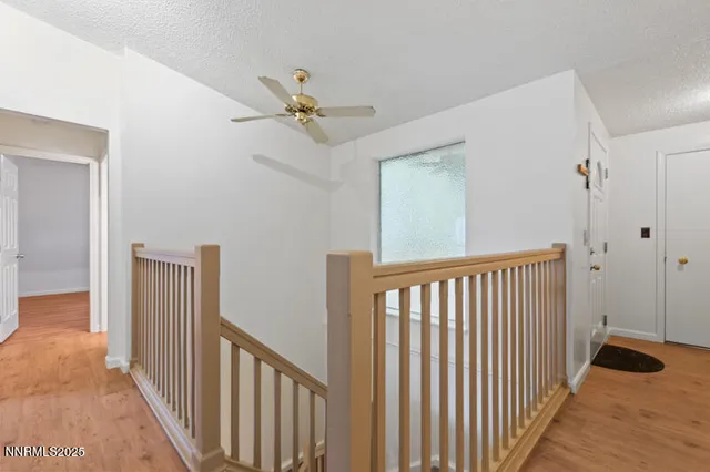 a view of hallway with wooden floor
