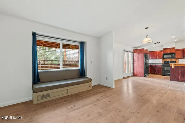 a view of kitchen with furniture and a window