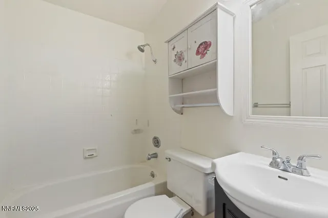 a bathroom with a sink a toilet and a bathtub