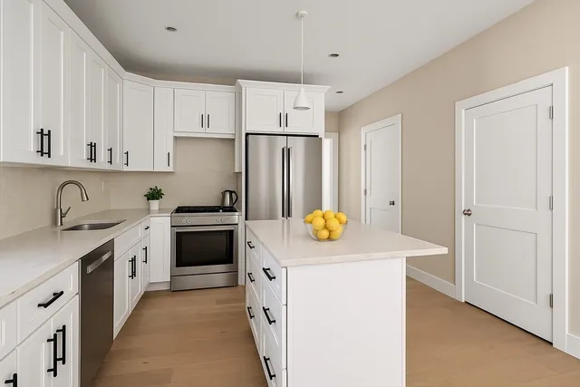 a view of kitchen with cabinets and stainless steel appliances