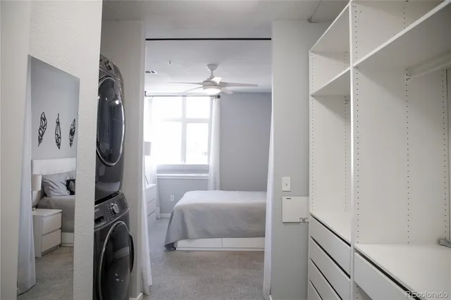 a bathroom with a granite countertop bathtub shower sink and vanity