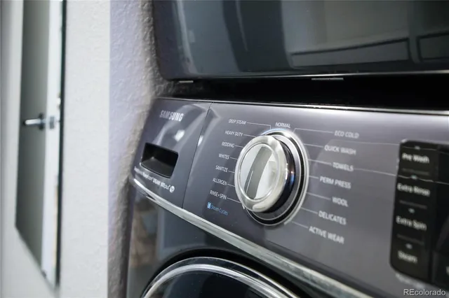 a view of a balcony with wooden floor and iron stairs