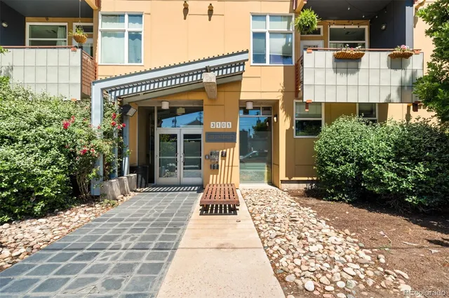 a view of a street with wooden fence