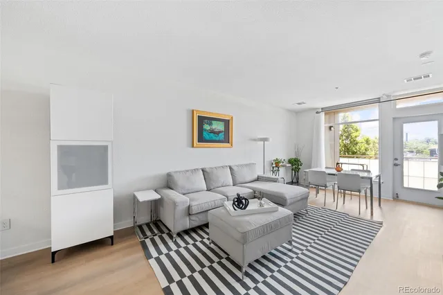 a living room with furniture and a table