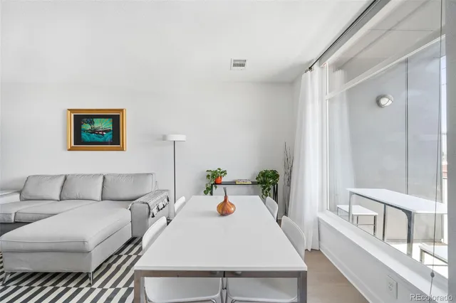 a living room with furniture and flat screen tv