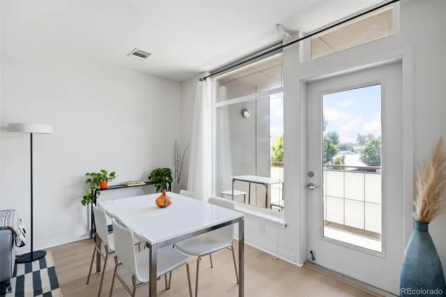 a view of a dining table and chairs in a room