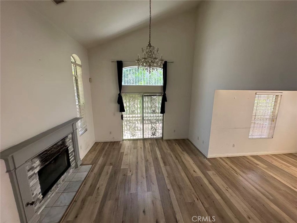 9532 Cortada Street El Monte, CA 91733 - Photo 5 of 10 a view of wooden floor and a fireplace in a room