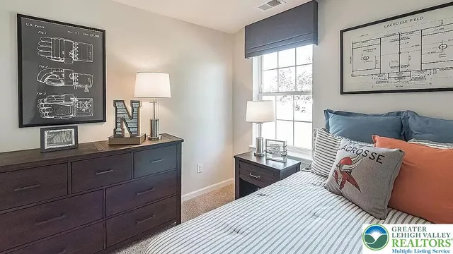 a view of bedroom with hardwood floor and bathroom