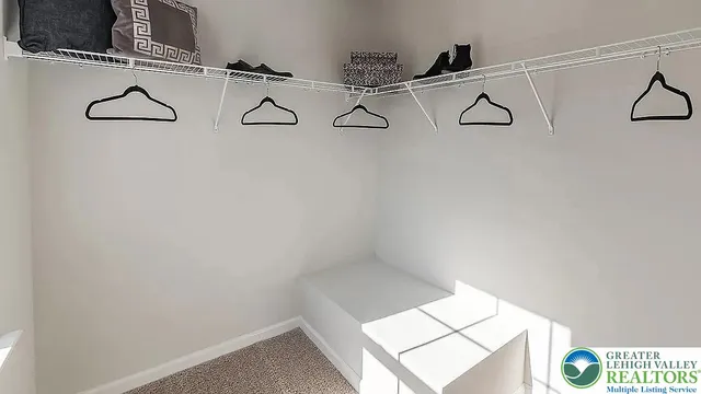 a bedroom with a bed and a night stand