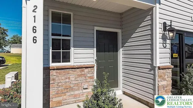 a room with a table chairs and a wooden floor
