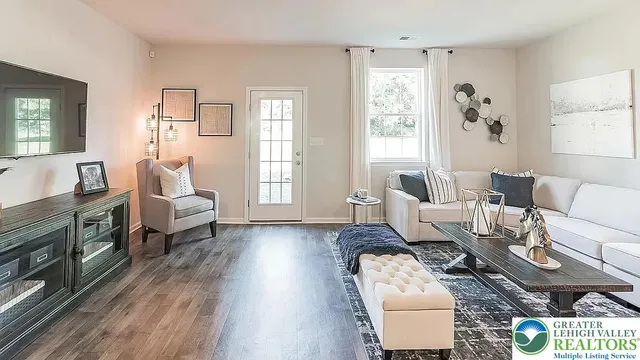 a kitchen with kitchen island granite countertop a refrigerator stove and sink