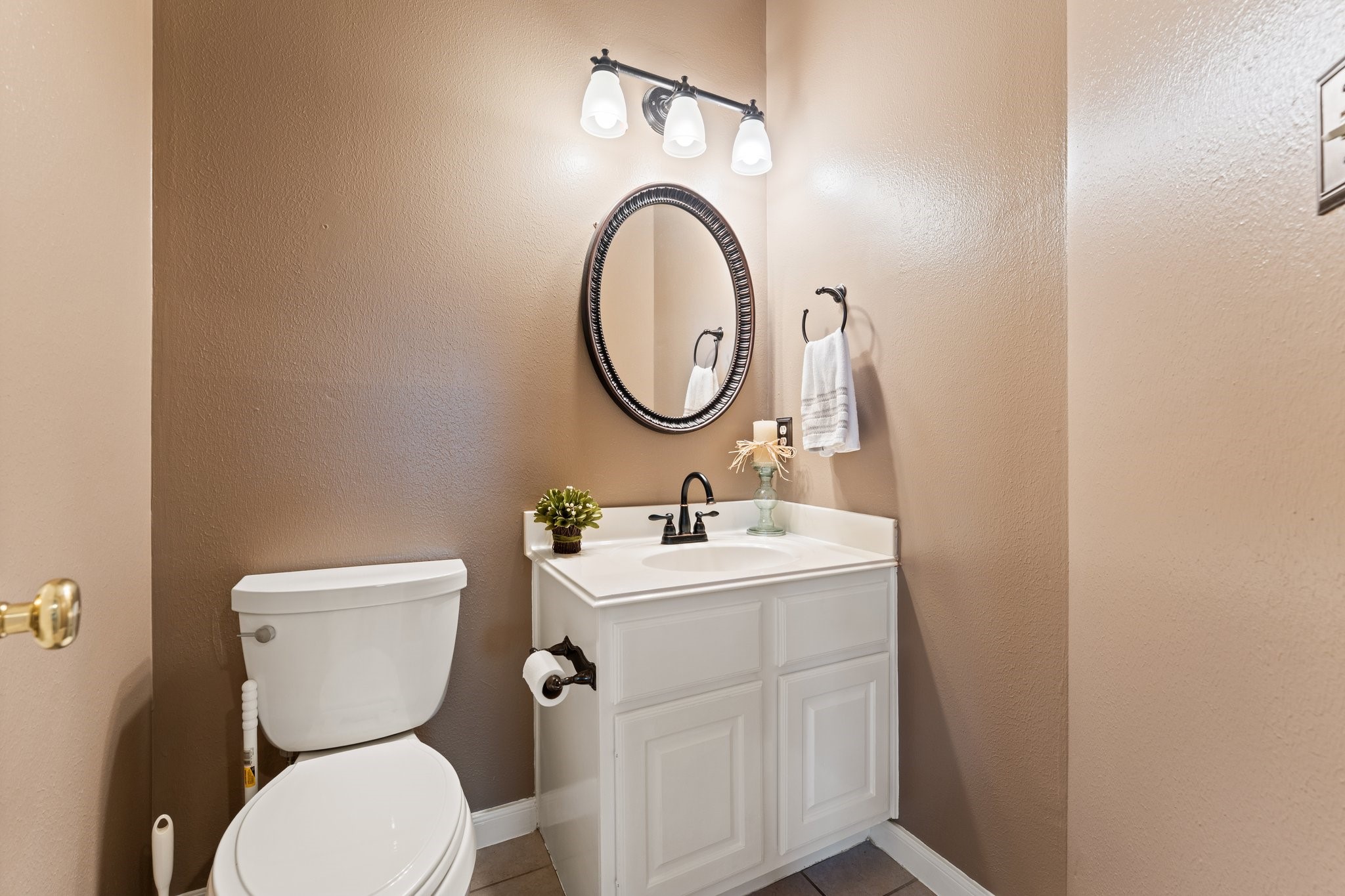 25447 China Springs Spring, TX 77373 - Photo 19 of 45 This welcoming powder room makes hosting easy, giving guests their own dedicated space while being conveniently located right outside your home office.