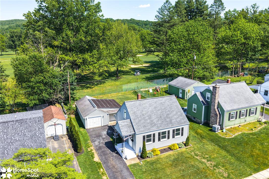 415 Willow Road Hellertown, PA 18055 - Photo 3 of 25 Discover a charming home set against a verdant golf course, offering serene outdoor living.