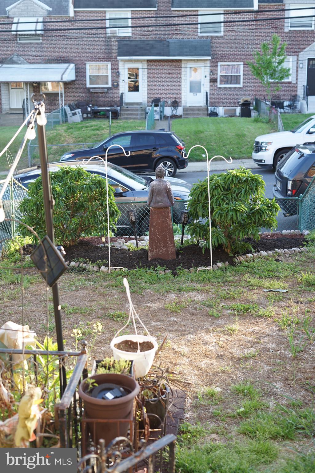 735 Grant Road Folcroft, PA 19032 - Photo 4 of 39 Charming garden with a serene statue.