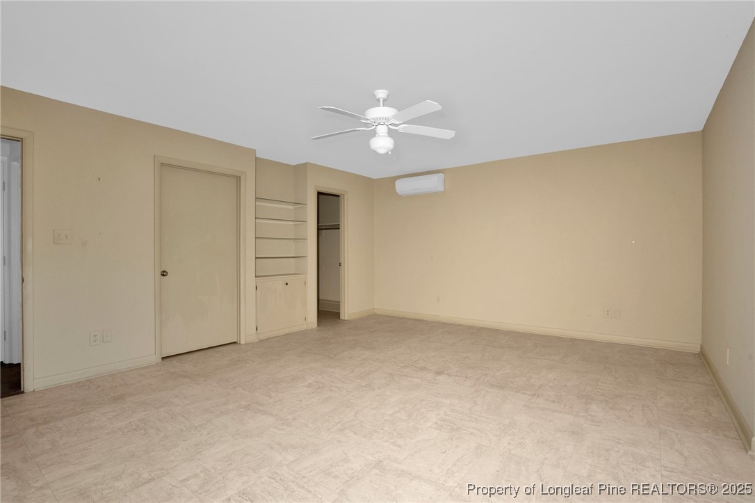 549 Rainforest Road Hope Mills, NC 28348 - Photo 12 of 40 an empty room with closet and a ceiling fan