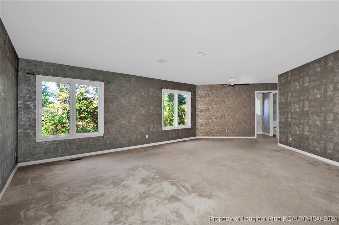 549 Rainforest Road Hope Mills, NC 28348 - Photo 17 of 40 an empty room with windows