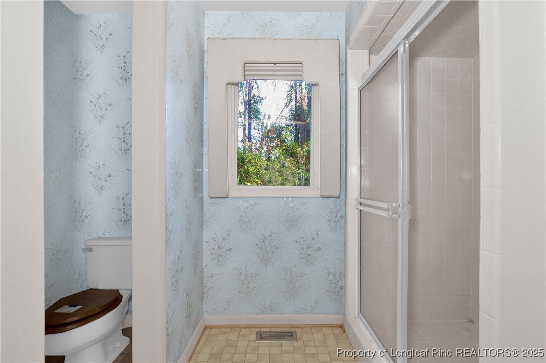549 Rainforest Road Hope Mills, NC 28348 - Photo 20 of 40 a bathroom with a sink and a toilet