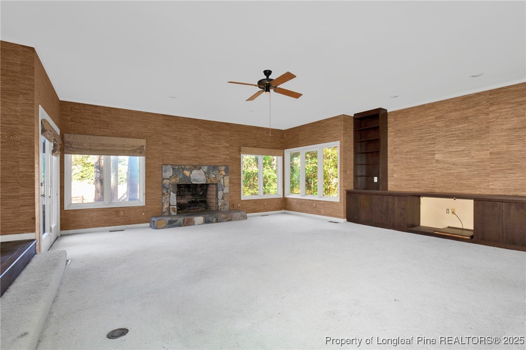 549 Rainforest Road Hope Mills, NC 28348 - Photo 2 of 40 a view of an empty room with a fireplace and a window