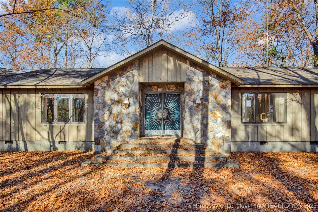 549 Rainforest Road Hope Mills, NC 28348 - Photo 26 of 40 a front view of a house with a yard