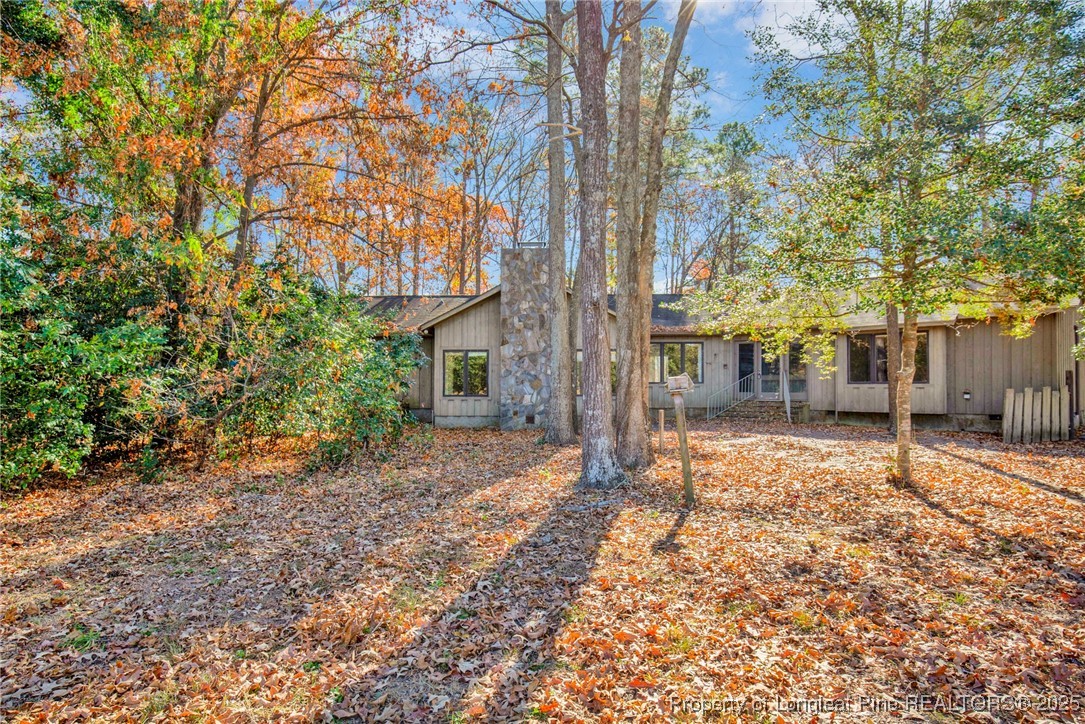 549 Rainforest Road Hope Mills, NC 28348 - Photo 28 of 40 a view of a house with a backyard