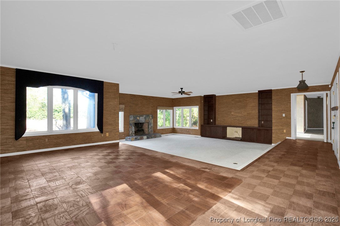549 Rainforest Road Hope Mills, NC 28348 - Photo 3 of 40 a view of an empty room with a fireplace and a window