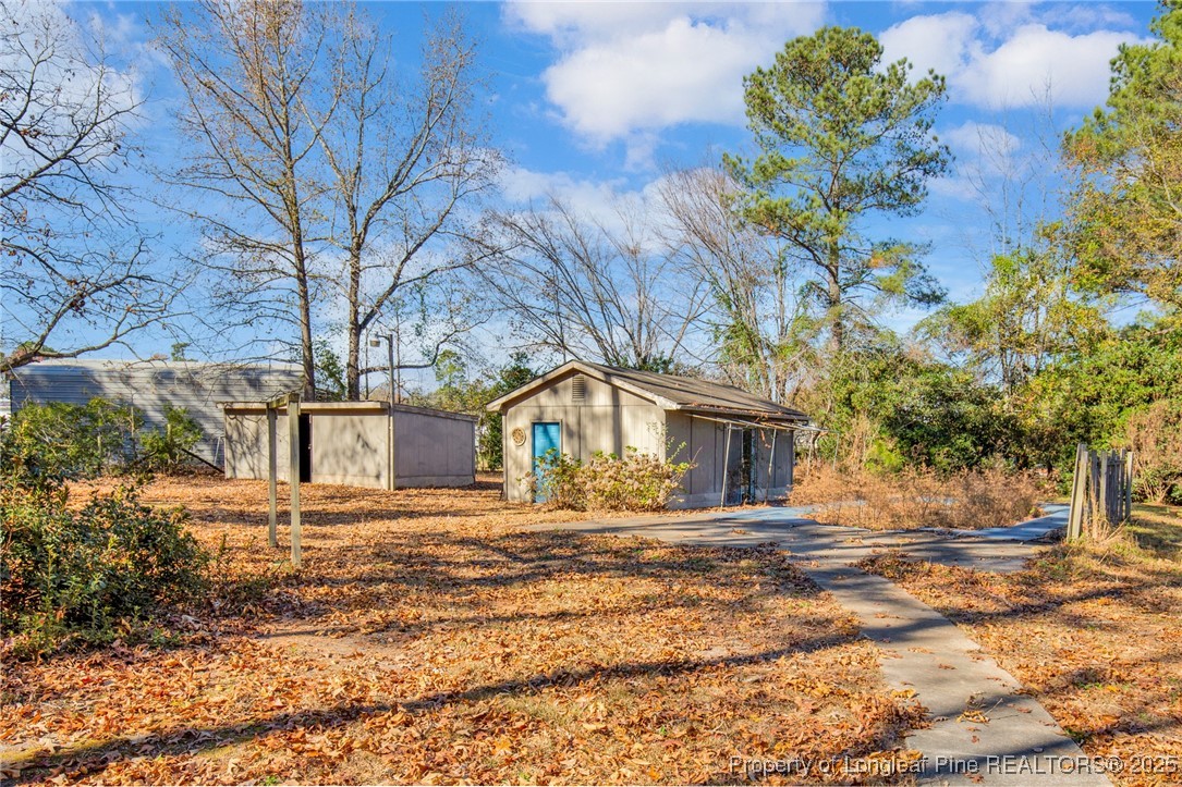 549 Rainforest Road Hope Mills, NC 28348 - Photo 34 of 40 a front view of a house with a yard